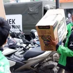 Tujuh Ton Bantuan Gojek Peduli Mendarat di Sentani Tujuh Ton Bantuan Gojek Peduli Mendarat di Sentani