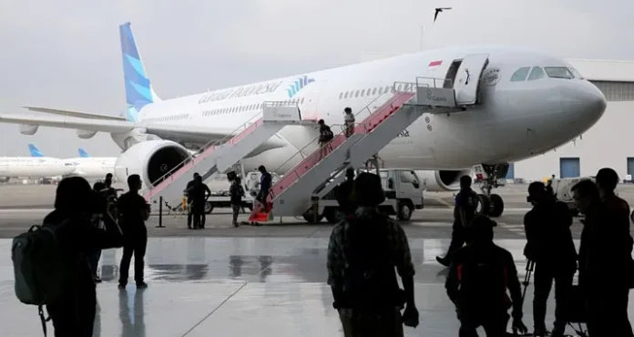 garuda indonesia Garuda Indonesia Bakal Beri Layanan Nikah di Pesawat
