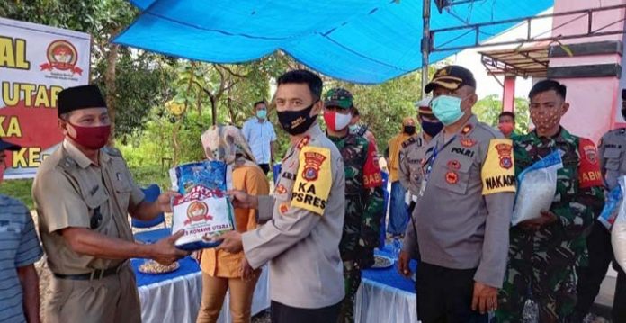 Peduli Covid-19, Polres dan Wartawan Konut Gelar Bakti Sosial