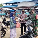 Cegah Penyebaran Covid-19, Polsek Kusambi Bagikan Masker Gratis Cegah Penyebaran Covid-19, Polsek Kusambi Bagikan Masker Gratis