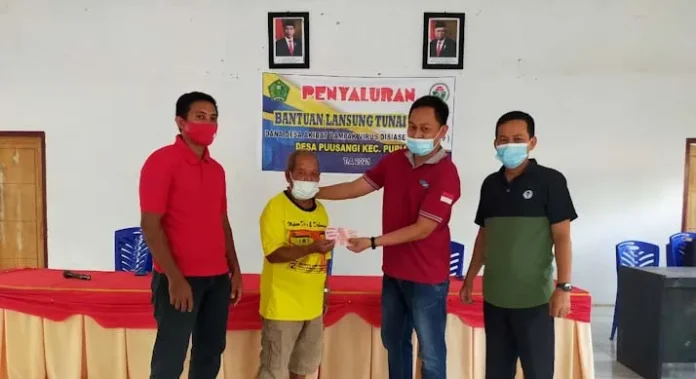 PSX_20210512_174252 Pemdes Puusangi Salurkan BLT Tahap II kepada 85 KPM