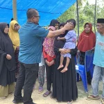 Pj Bupati Mubar Beri Bantuan kepada Keluarga Korban Penembakan di Papua Pj Bupati Mubar Beri Bantuan kepada Keluarga Korban Penembakan di Papua