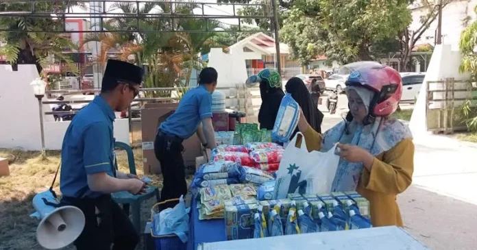BI Kenalkan QRIS pada Masyarakat di Pasar Murah Disperindag Sultra